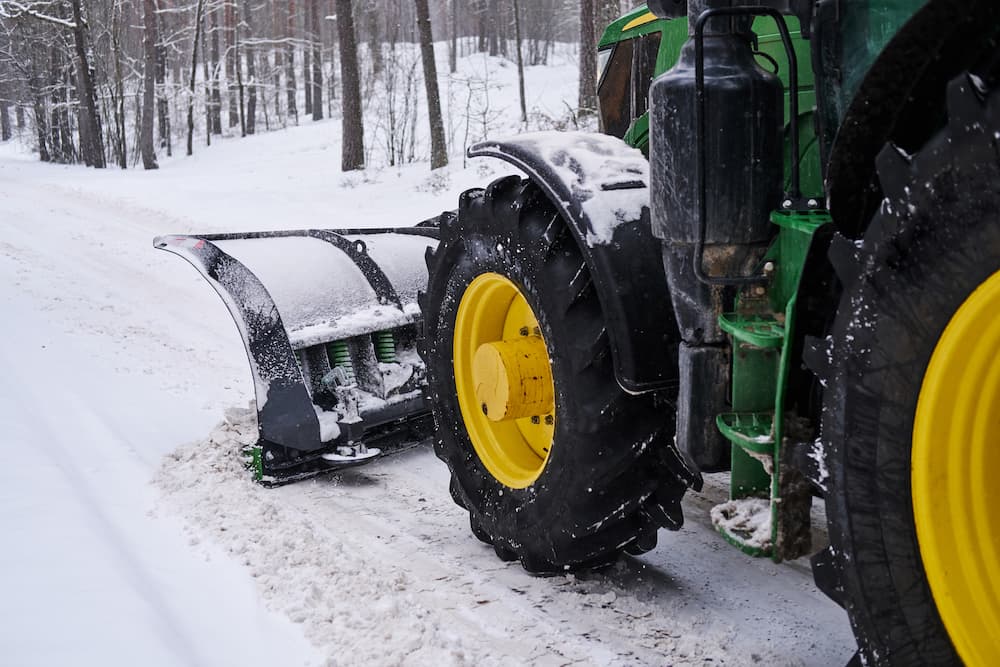 big special tractor is removing snow from forestal road 1 Landscaping services Landscaping services,Lawn Care and Landscaping,horticulturalists